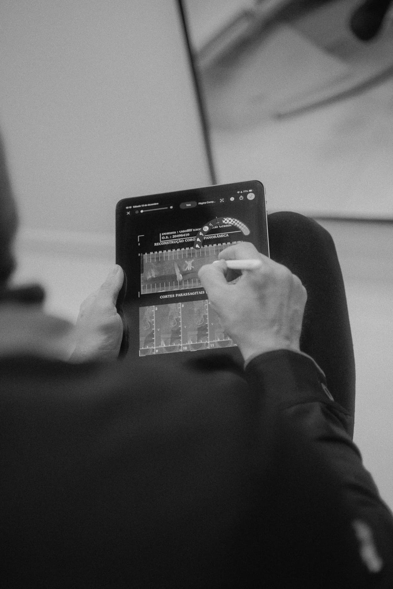 Dr. Landa reviewing a digital 3D dental plan on an iPad